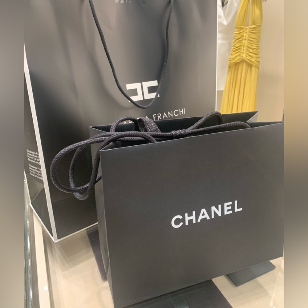 Authentic Chanel dust bag with strings, mid size , brand new condition.